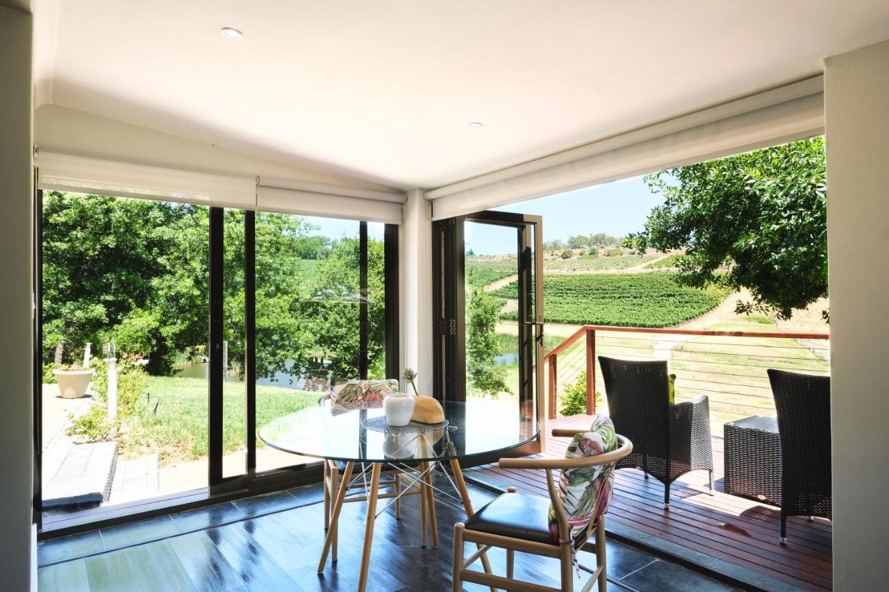 Alluvia Boutique Winery & Luxury Accommodation Stellenbosch Dış mekan fotoğraf A room with a view of the vineyards
